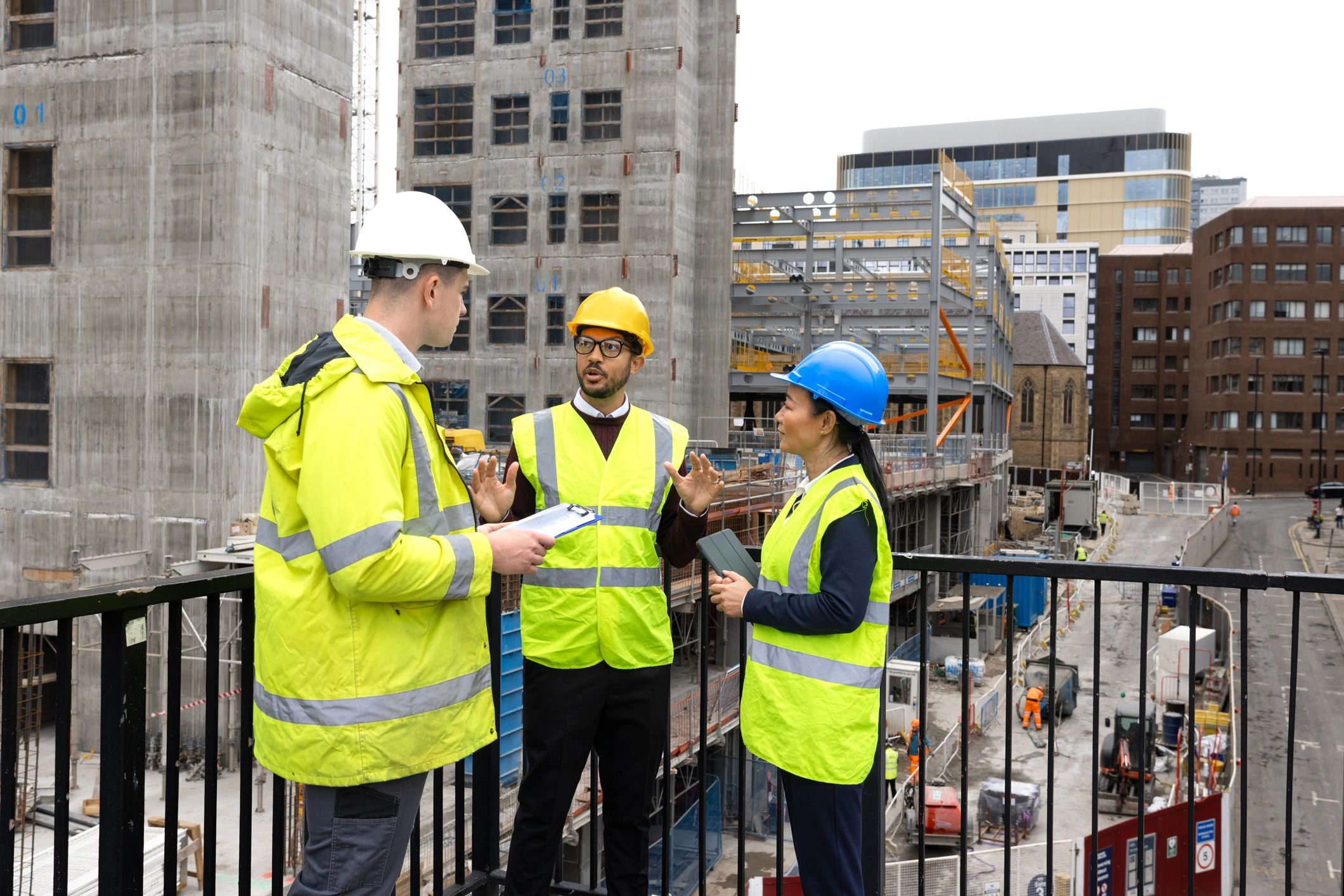Construction team reviewing plans at an active site